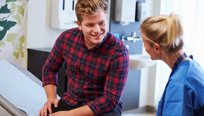 Young man in consultation with doctor