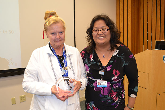 Director of Service Excellence and Performance Improvement  Kae Santos Right) honors Elizabeth “Betty” Podgurski for her  more than 10,000 of volunteer service