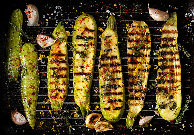 A row of vegetables on a grill