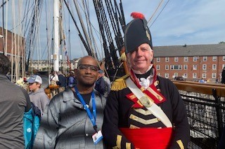 Darryl Croon standing with crew member