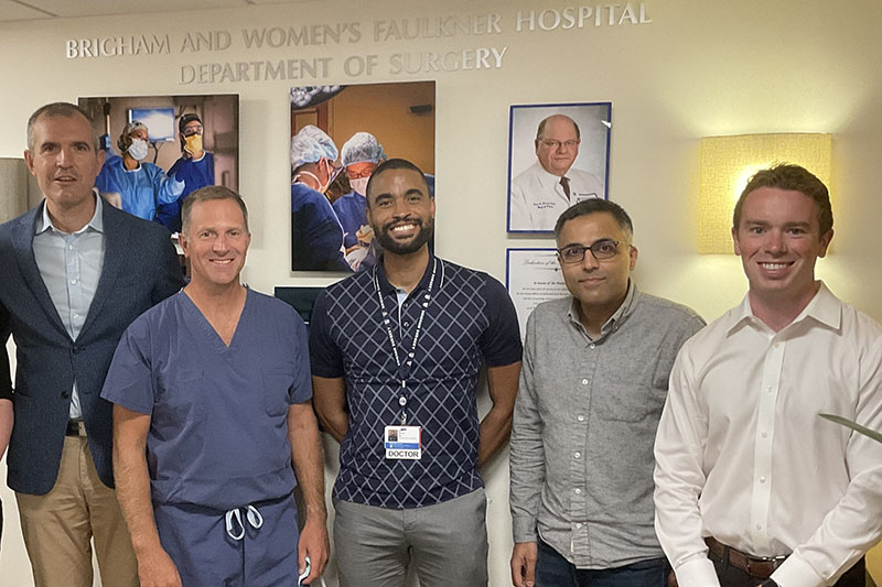 Five male employees standing in BWFH's surgical suite
