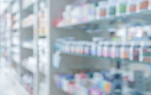 Pharmacy shelves stocked with medication