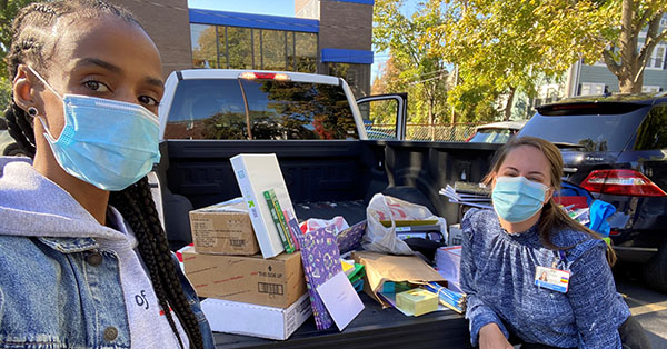 Image of staff collecting school supplies