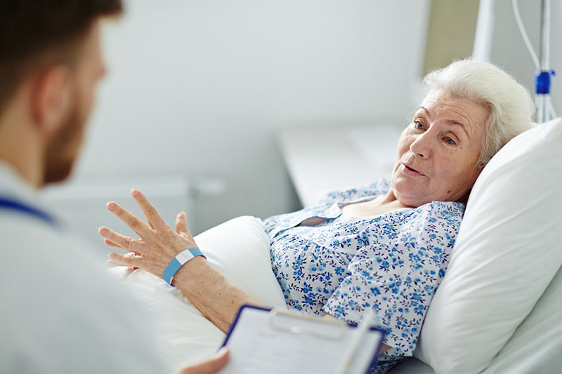 Female senior patient in a hospital bed