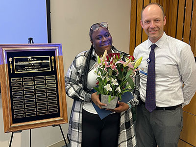 Compassionate Care Award recipient Kharma Joseph, MHW, with Christopher AhnAllen, PhD